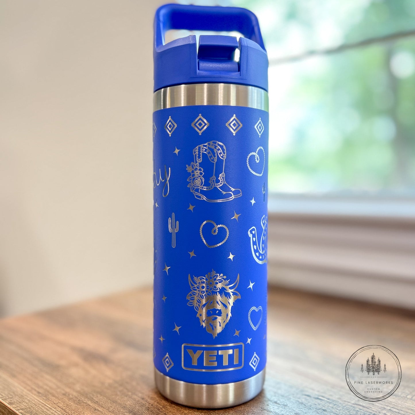 Highland Cow Yeti 18oz Rambler Straw Top Water Bottle Western Theme - Pine LaserworksUltramarine Violet YETI insulated bottle with western design on a wooden surface.