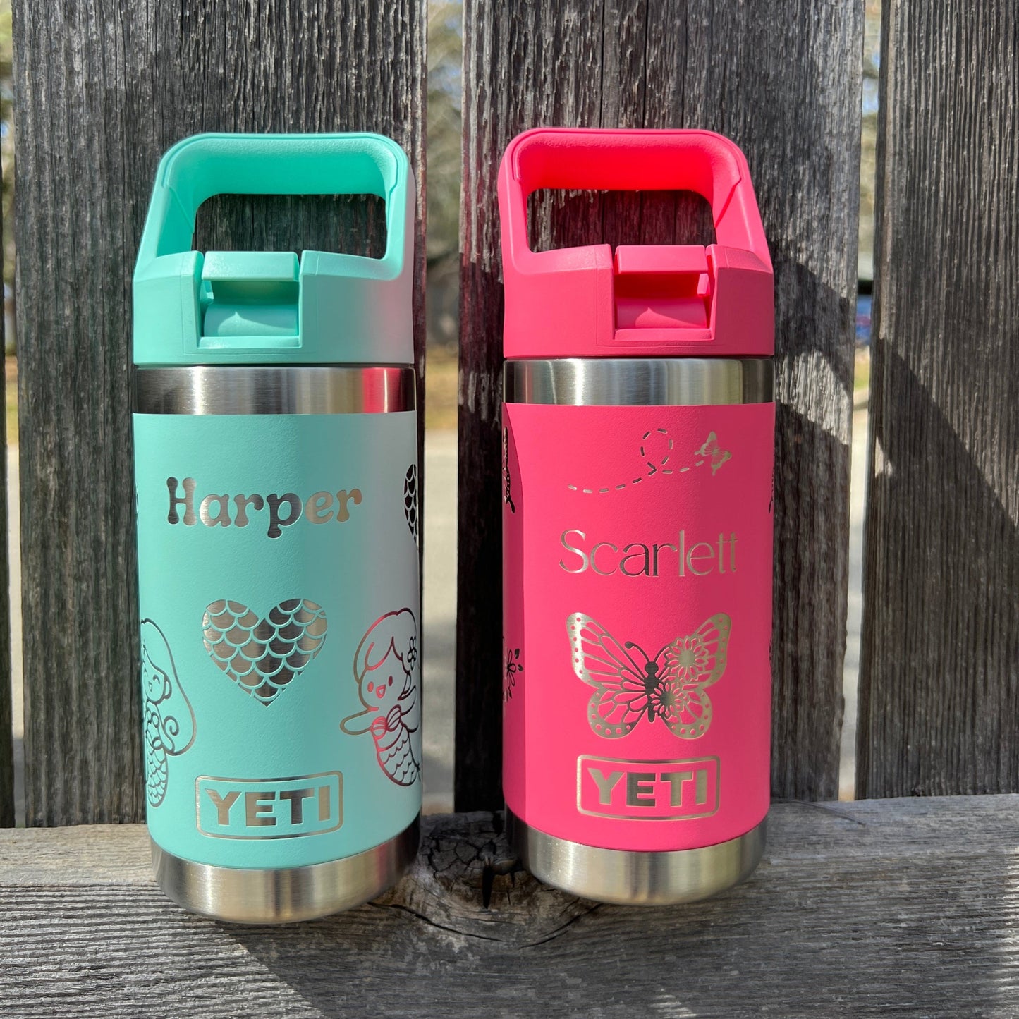 Personalized Kids Yeti 12 oz Water Bottle 12 Design Options - Pine LaserworksTwo YETI brand tumblers, one tropical pink and one seafoam, on a wooden surface.