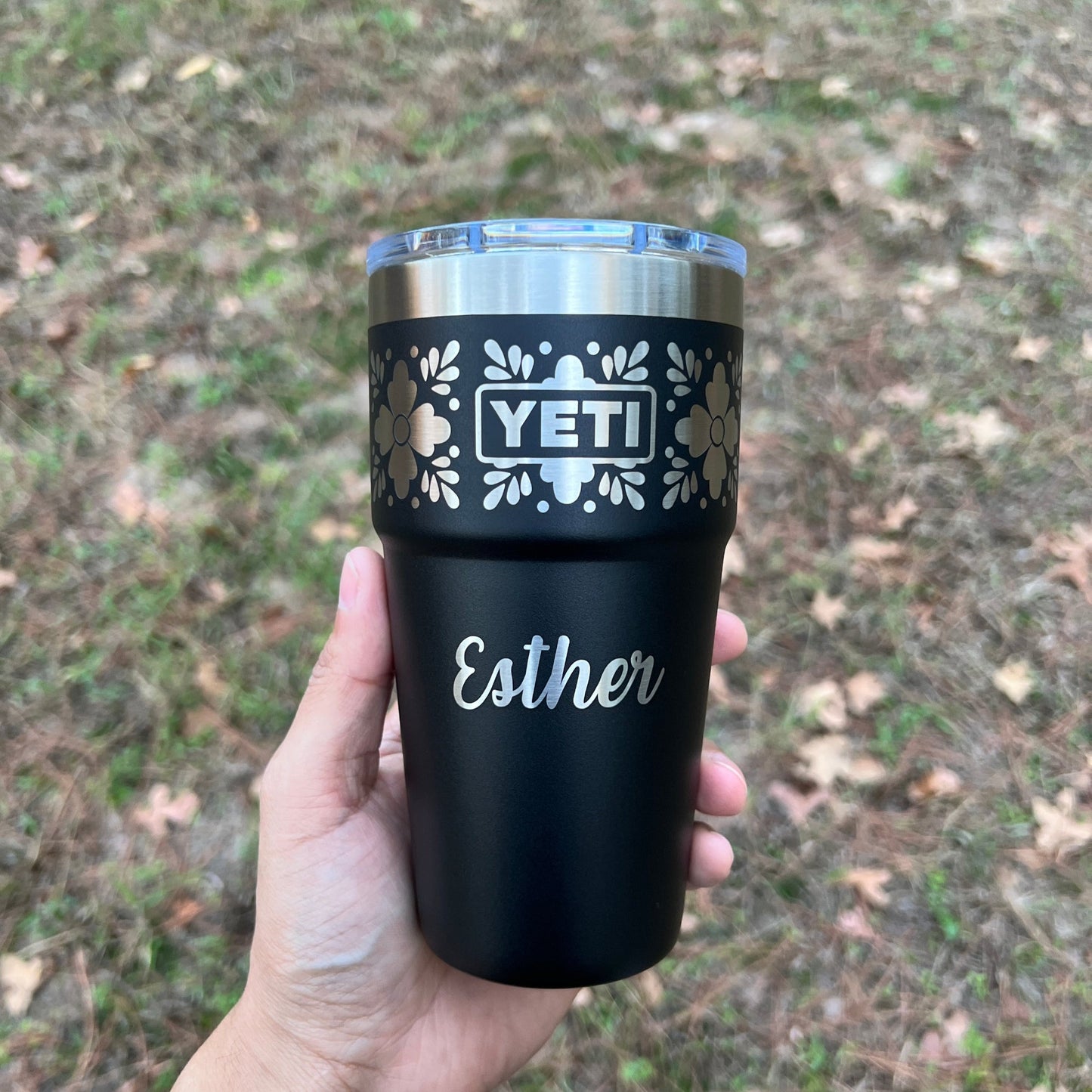 Personalized Talavera Flower Yeti 20oz Stackable Cup - Pine LaserworksBlack Yeti tumbler with personalized name held in a hand against a natural background