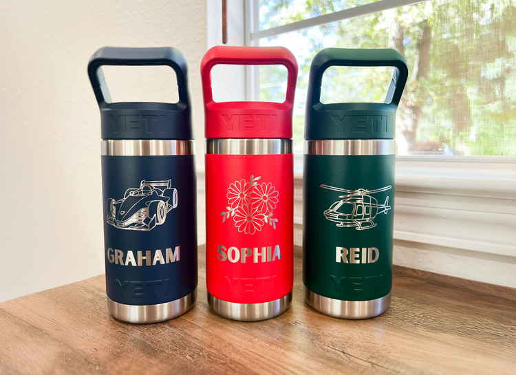 Four personalized YETI kids water bottles in red, lilac, blue, and purple