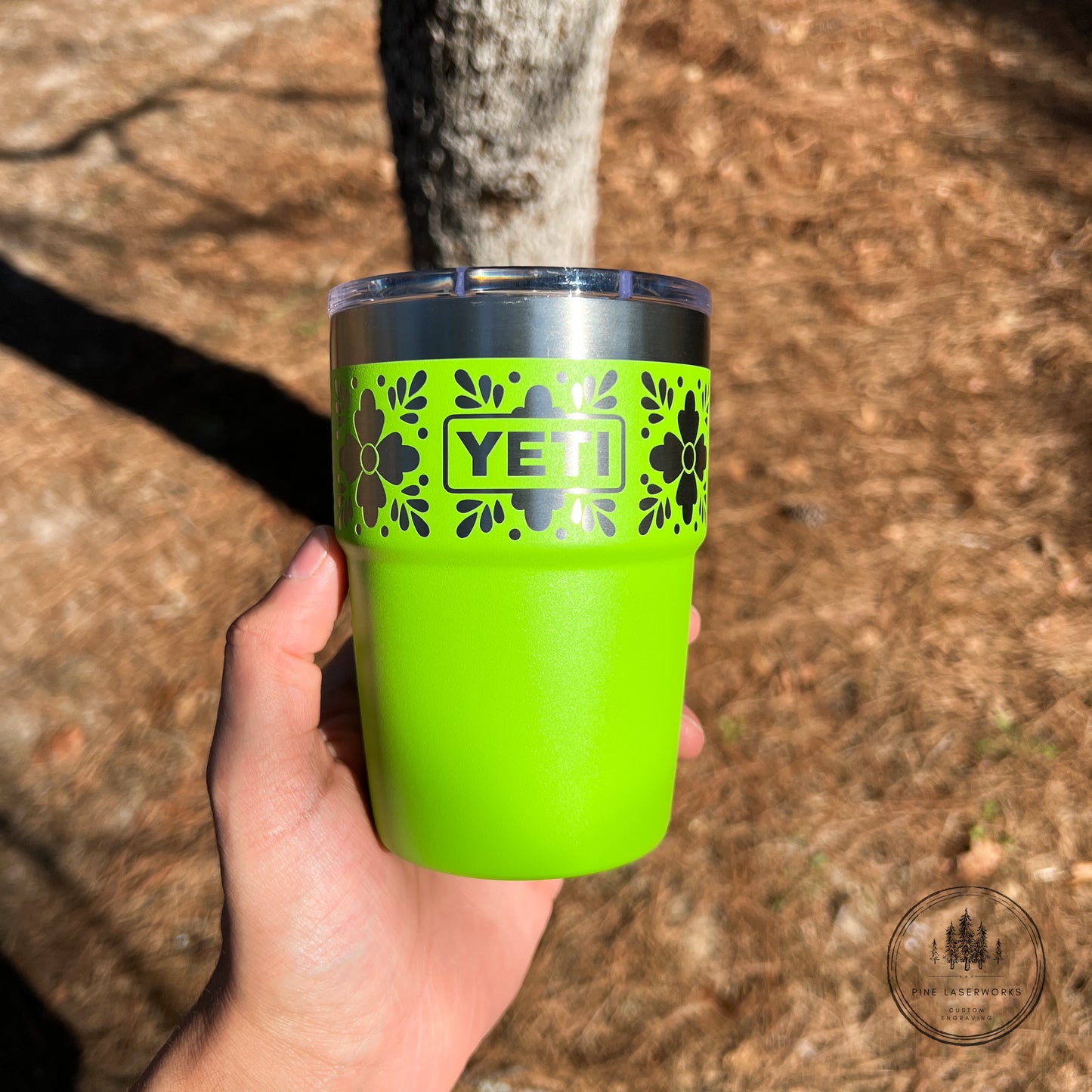 Venom Green YETI tumbler with a Talavera pattern against a natural background.