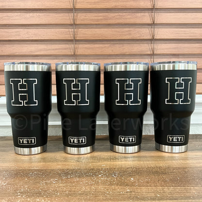 Four black YETI 30oz Tumblers engraved with a large white letter 'H'