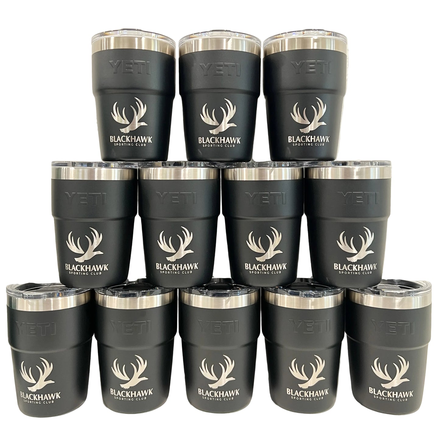 Multiple black Yeti tumblers with Blackhawk Sporting Club logo on a white background