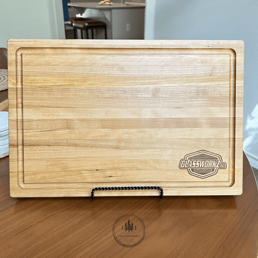 Wooden cherry serving board with a recessed juice groove around the perimeter