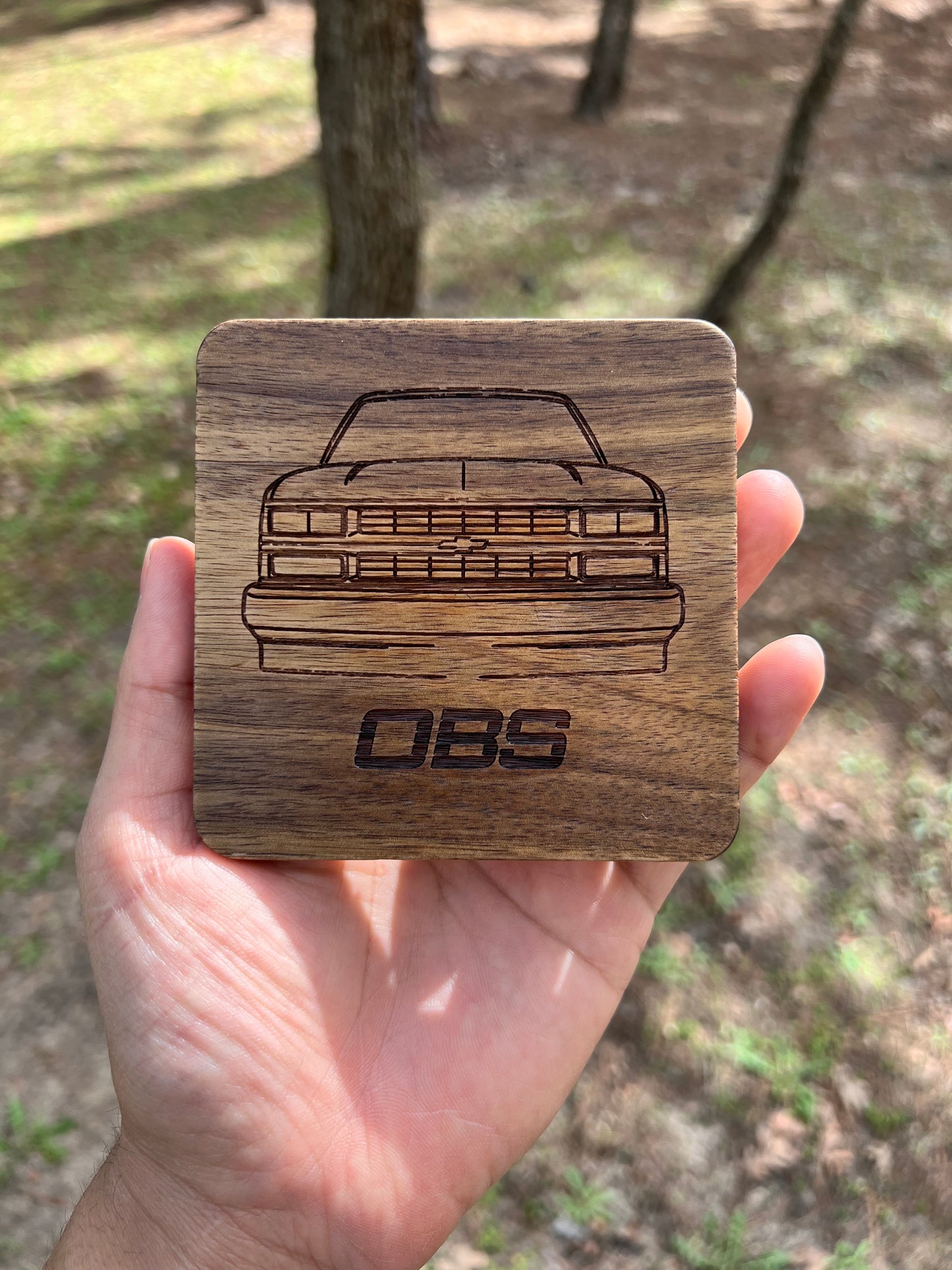 Acacia wood square shape coasters with 88 to 98 Chevy truck front end outline and OBS letters below. Rustic Look and great satin finish.