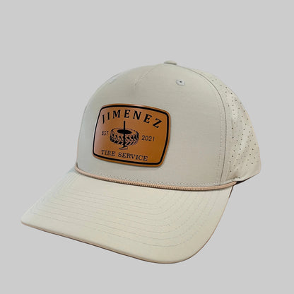 Light beige Richardson 355 rope hat with a brown 'JIMENEZ Tire Service' leatherette patch