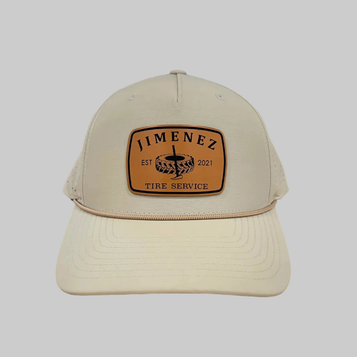 Light beige Richardson 355 rope hat with a tan 'JIMENEZ TIRE SERVICE' leatherette patch