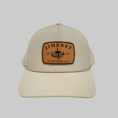 Light beige Richardson 355 rope hat with a tan 'JIMENEZ TIRE SERVICE' leatherette patch