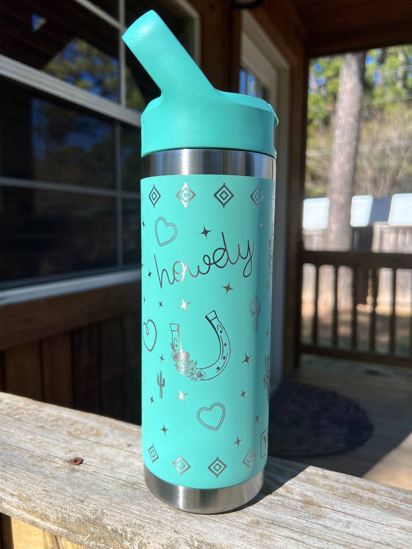 Highland Cow Yeti 18oz Water Bottle Western Theme in Seafoam Color - Pine LaserworksYeti Flip Straw Cap 18oz Rambler Water Bottle in Seafoam color Western theme with cactus rope heart highland cow cowboy boots and sparkle shapes all around beautiful shine and finish. full 360 engrave.