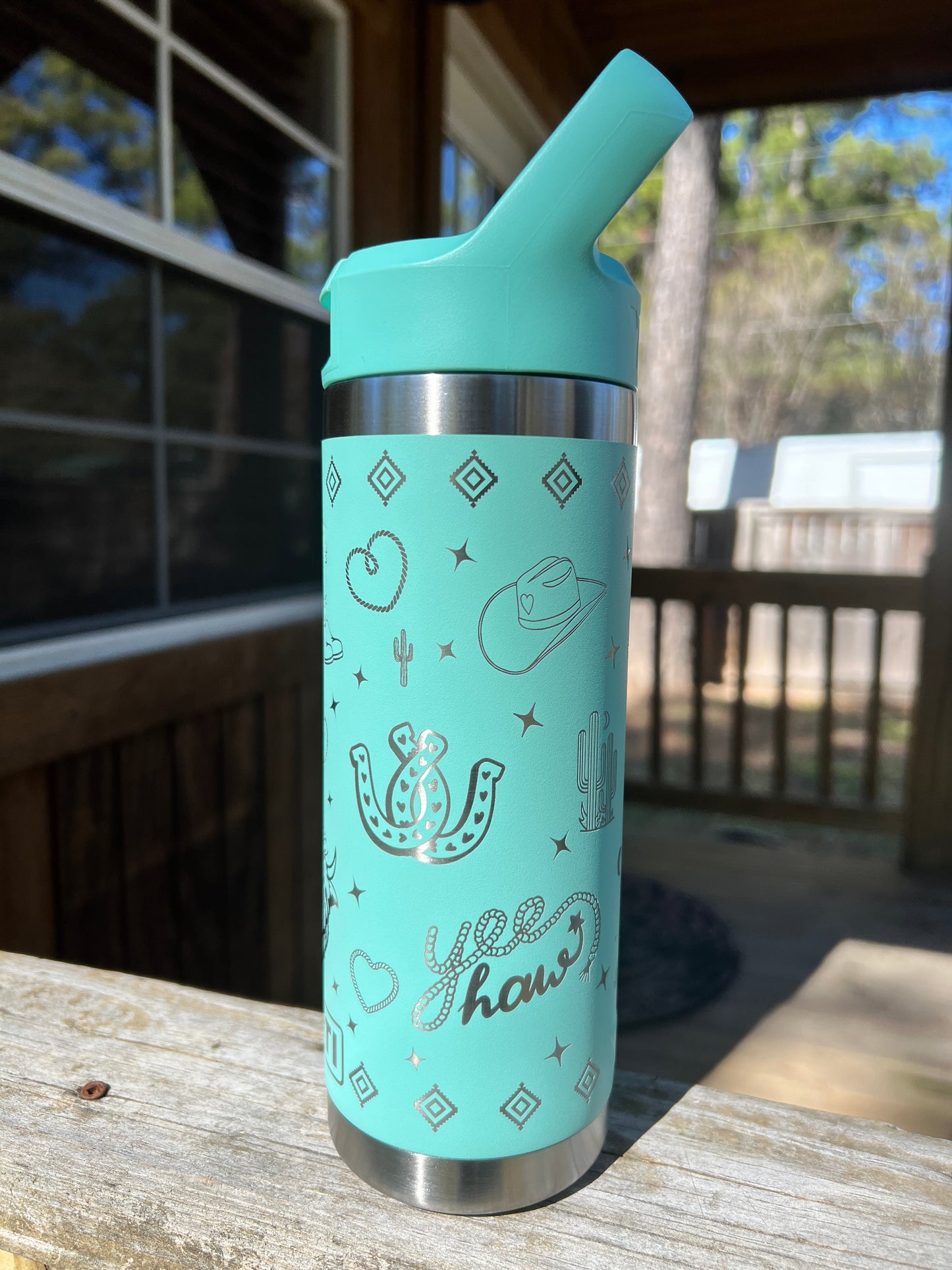 Highland Cow Yeti 18oz Water Bottle Western Theme in Seafoam Color - Pine LaserworksYeti Flip Straw Cap 18oz Rambler Water Bottle in Seafoam color Western theme with cactus rope heart highland cow cowboy boots and sparkle shapes all around beautiful shine and finish. full 360 engrave.