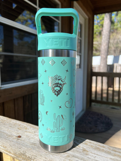 Highland Cow Yeti 18oz Water Bottle Western Theme in Seafoam Color - Pine LaserworksYeti Flip Straw Cap 18oz Rambler Water Bottle in Seafoam color Western theme with cactus rope heart highland cow cowboy boots and sparkle shapes all around beautiful shine and finish. full 360 engrave.