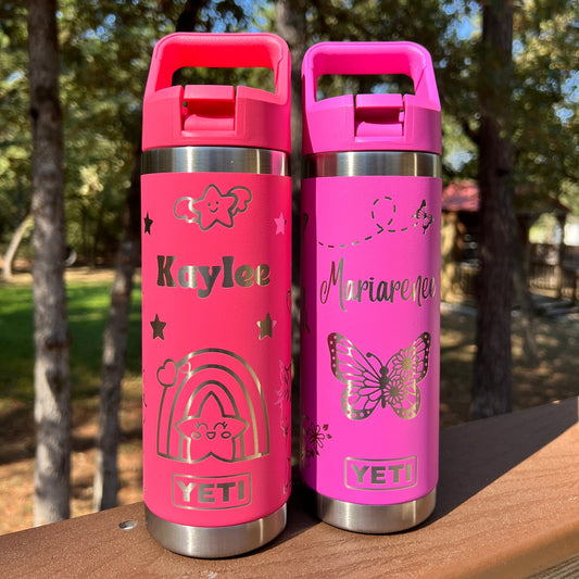 Personalized Kids Yeti 18 oz Rambler Straw Top Water Bottle - Pine LaserworksTwo pink YETI water bottles with personalized designs on a reflective surface.