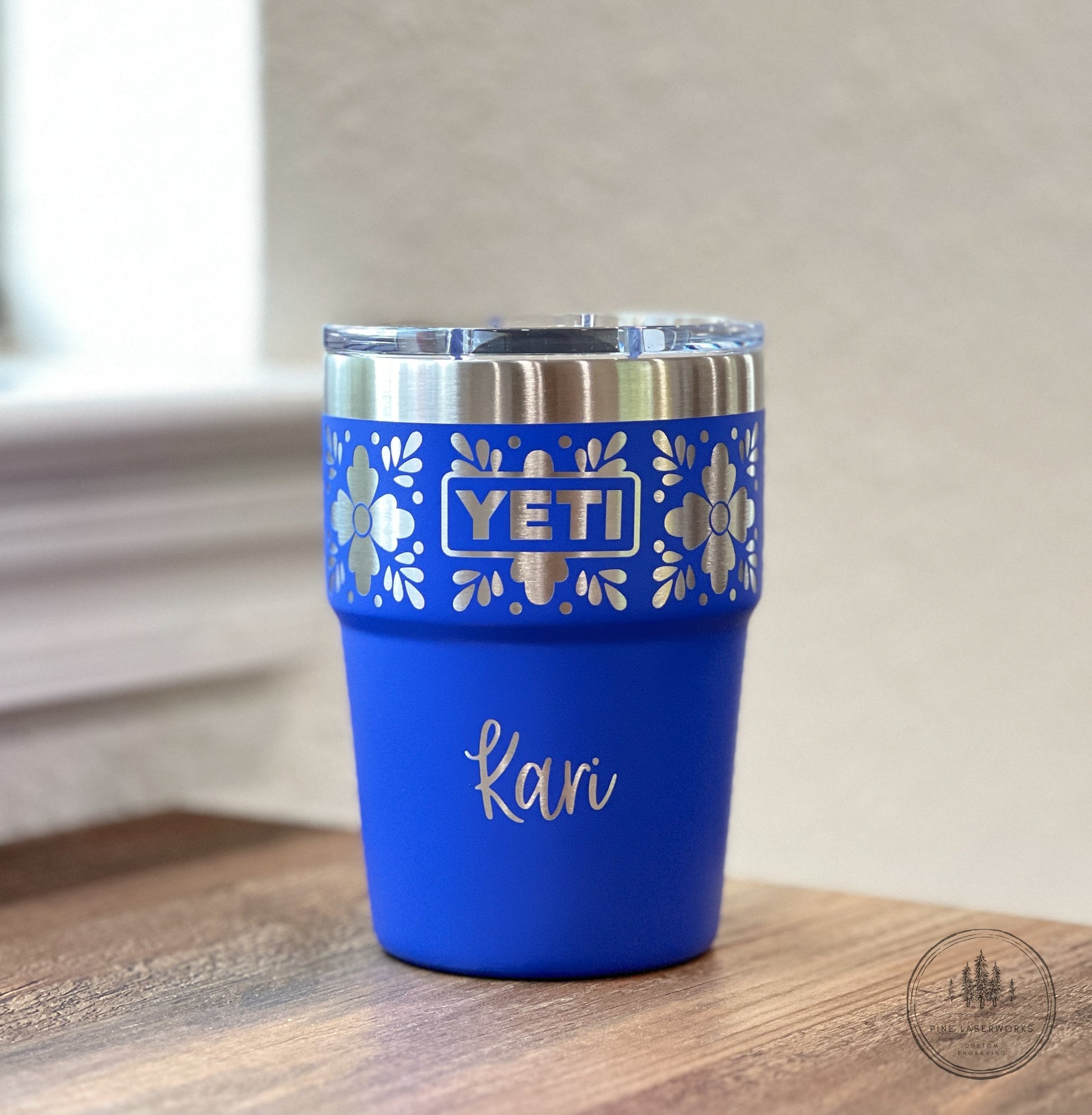 Personalized Talavera Flower Yeti 16oz Stackable Cup - Pine LaserworksUltramarine Violet YETI tumbler with floral design and 'Kari' engraving on a wooden surface.