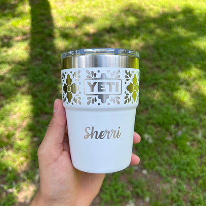Personalized Talavera Flower Yeti 16oz Stackable Cup - Pine LaserworksHand holding a YETI tumbler with 'Sherri' on a grassy background