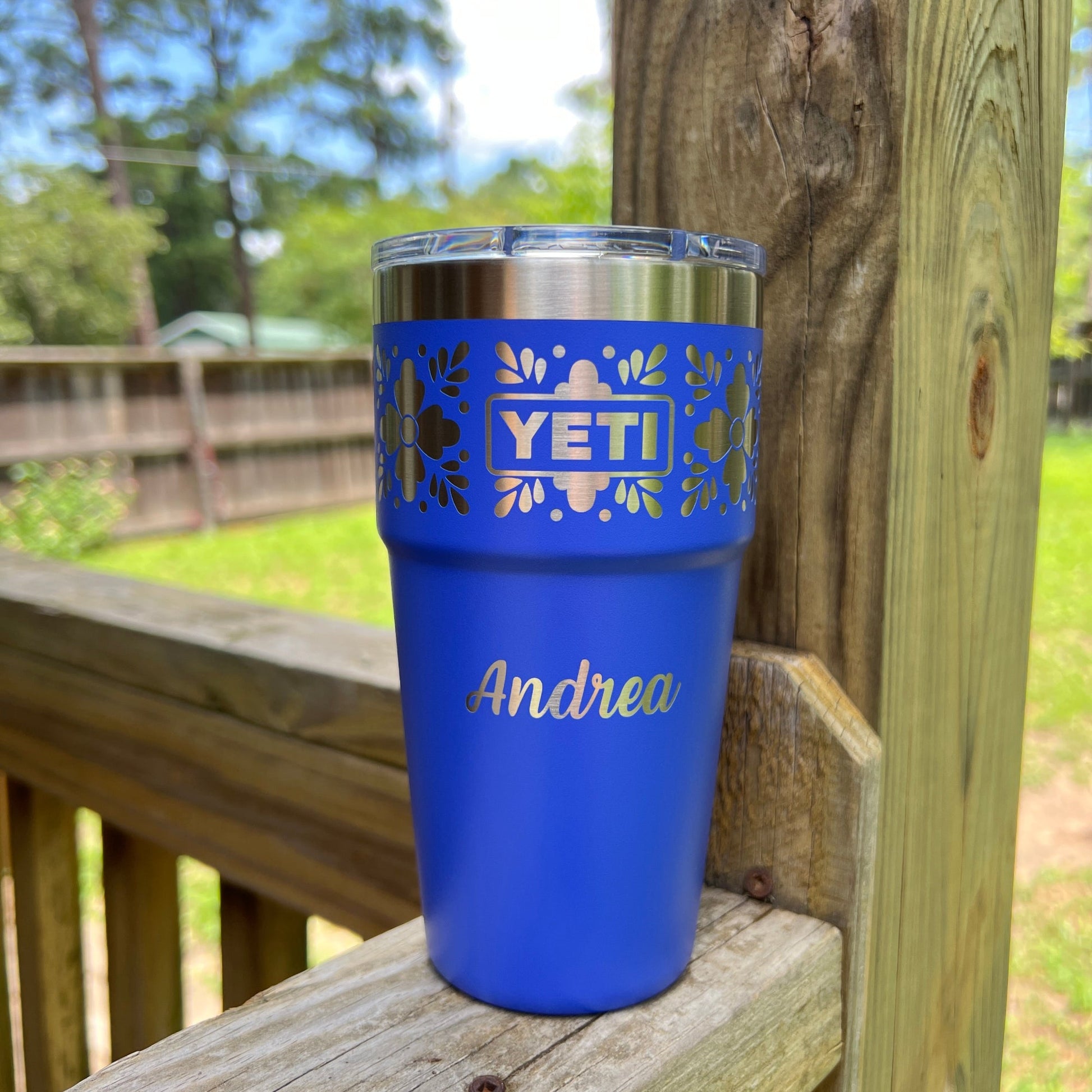 Personalized Talavera Flower Yeti 20oz Stackable Cup - Pine LaserworksUltramarine Violet YETI tumbler with 'Andrea' engraving on a wooden surface